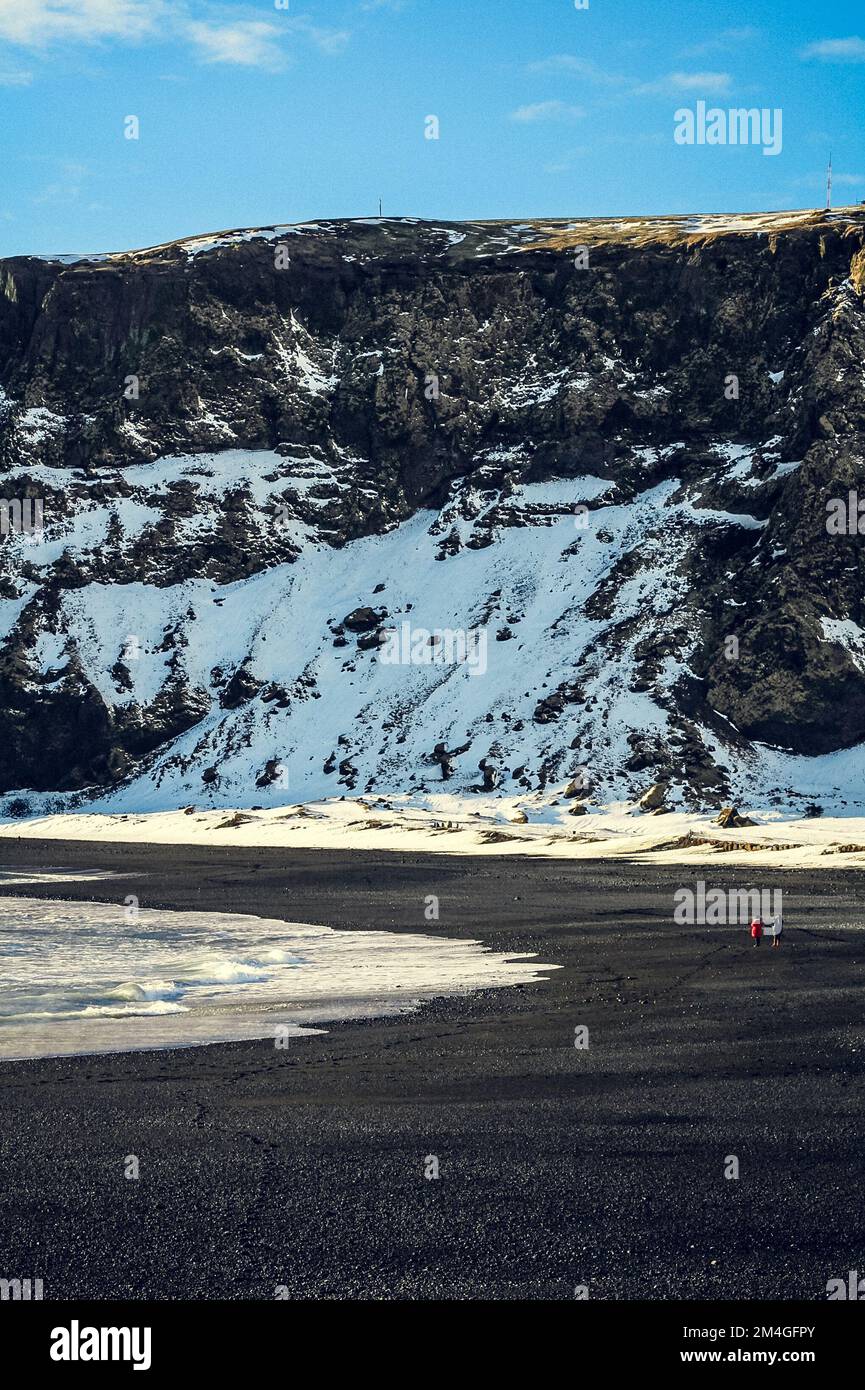 Tourists on picturesque Iceland beach landscape photo Stock Photo
