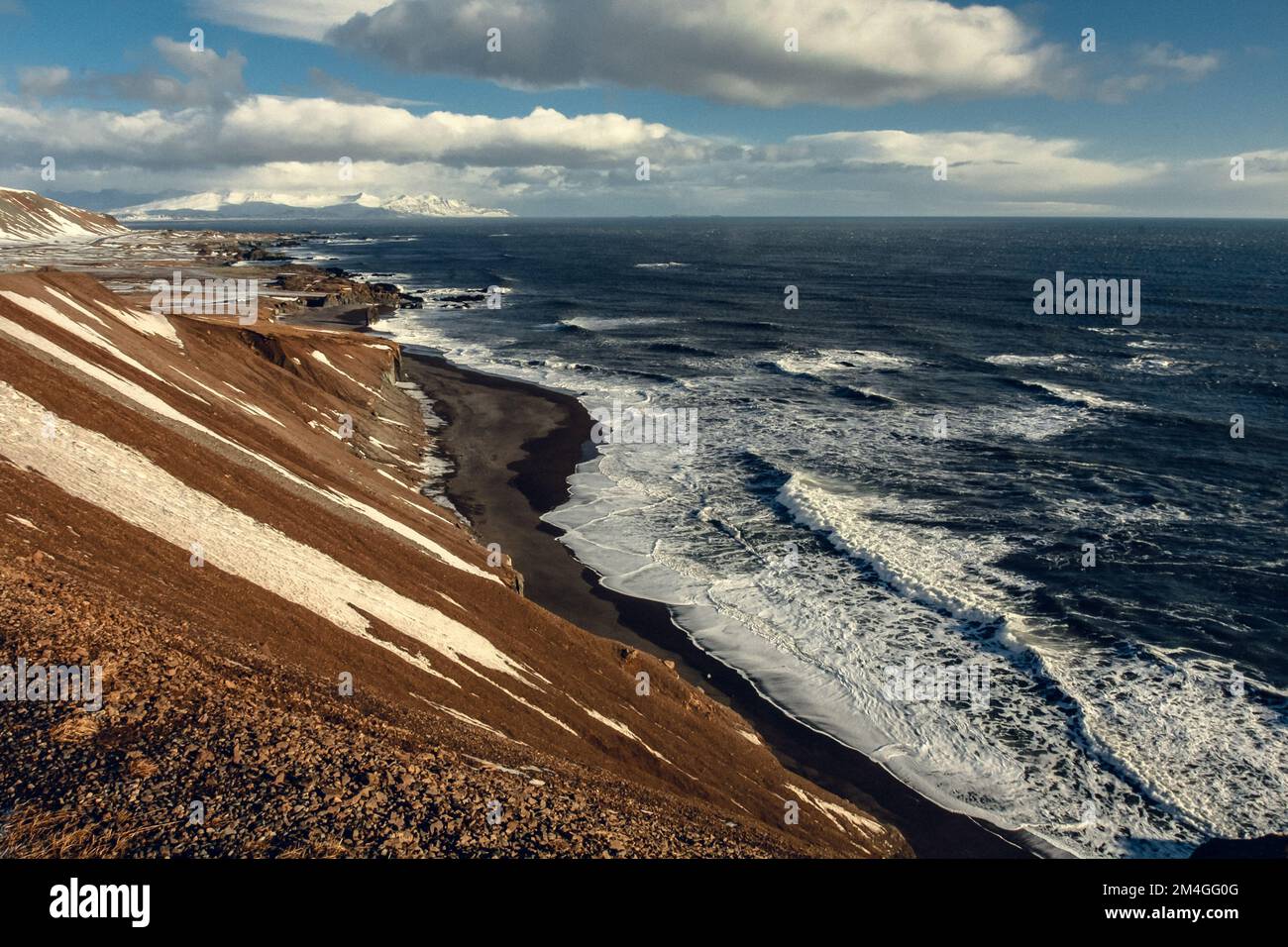 Volcanic beach with sea waves landscape photo Stock Photo