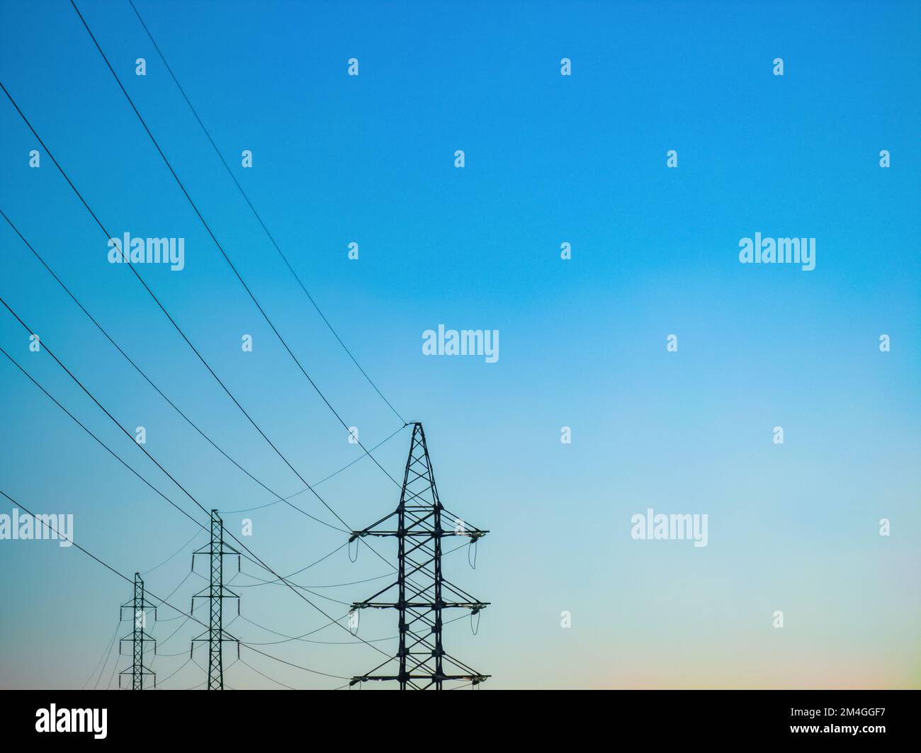 High voltage electricity power line towers against the sky Stock Photo ...