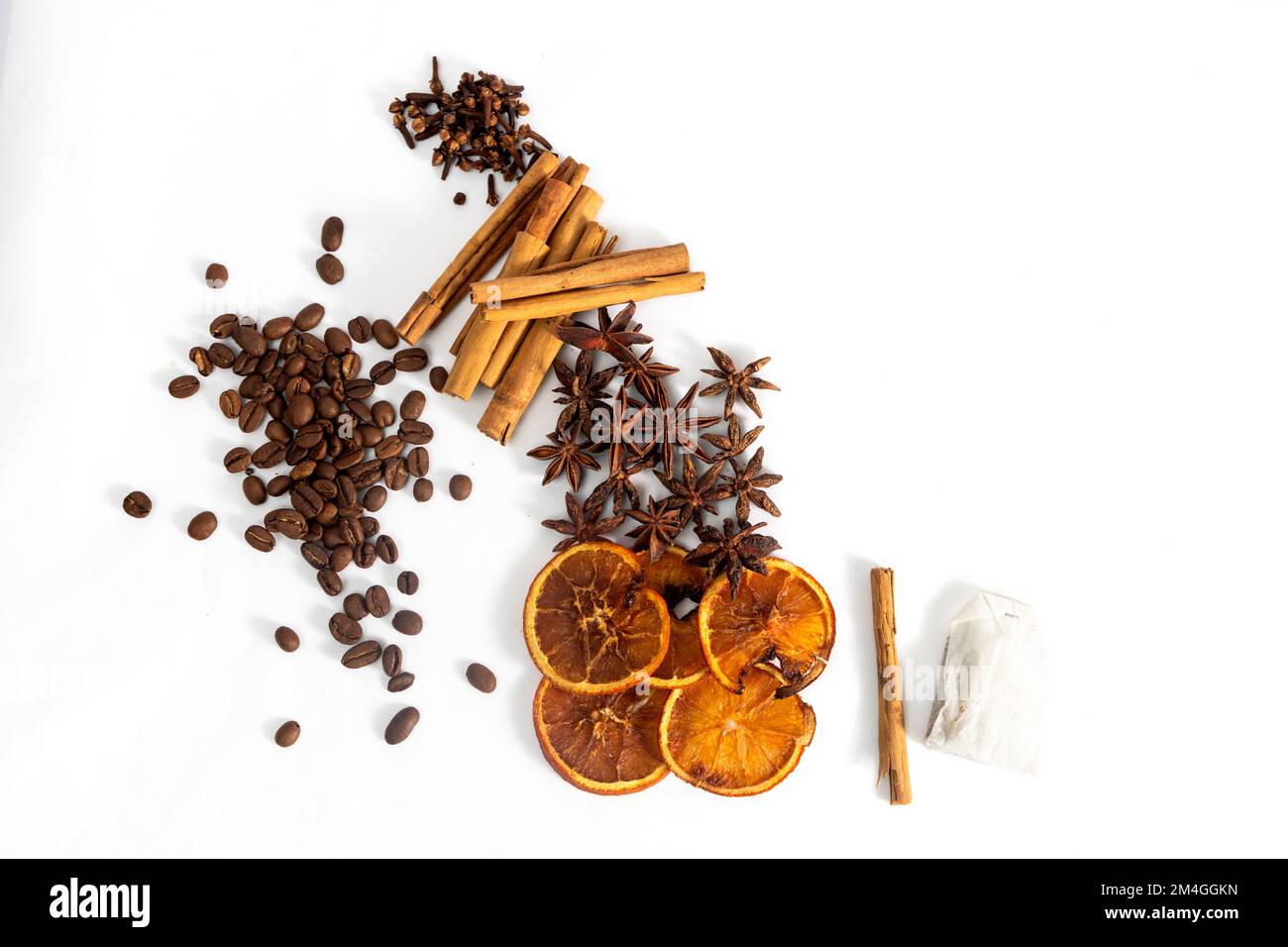 Mixture of spices for winter infusions, cinnamon, star anise, cloves, coffee on a white background Stock Photo