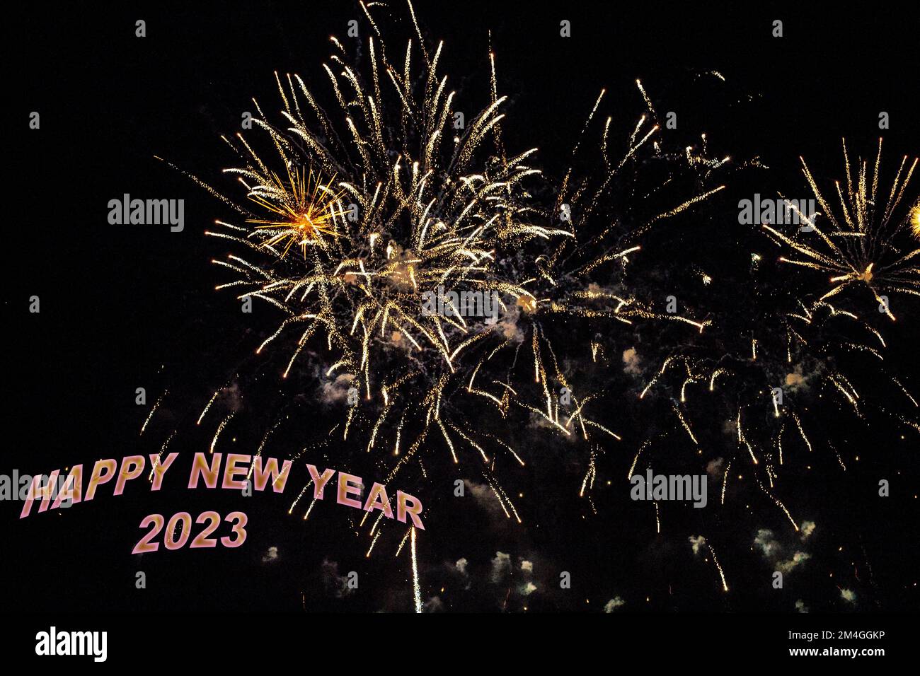 Fireworks to congratulate the new year 2023 with yellow or gold letters Stock Photo