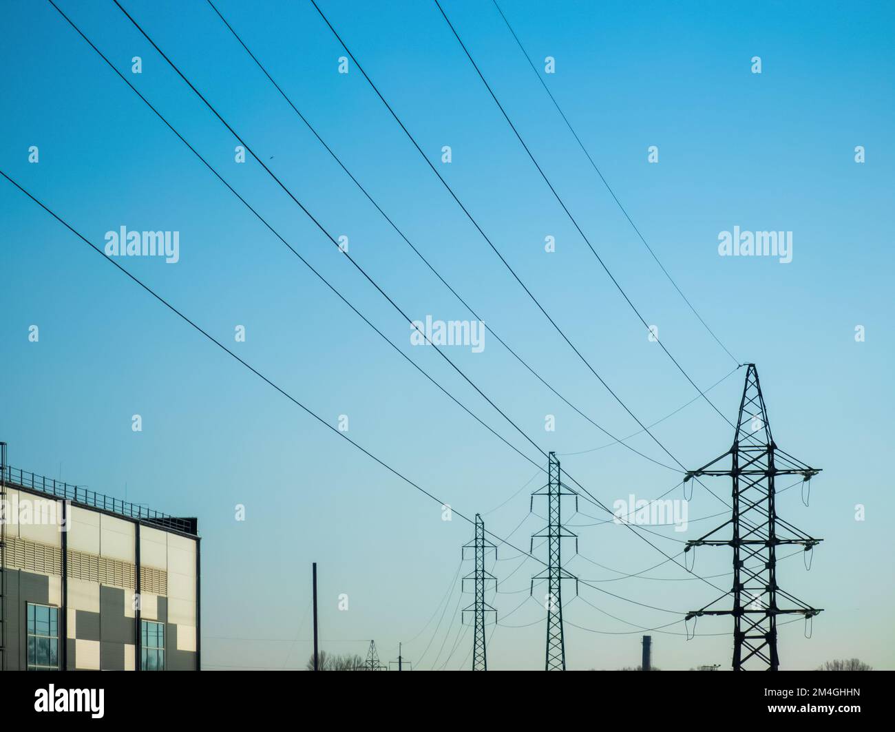 High voltage electricity power line towers against the sky Stock Photo ...
