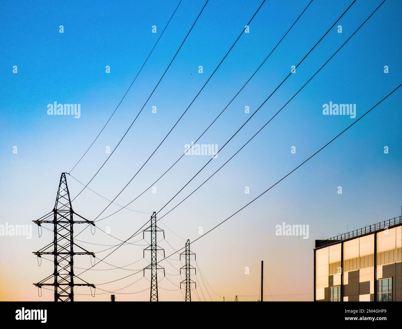 High voltage electricity power line towers against the sky Stock Photo ...
