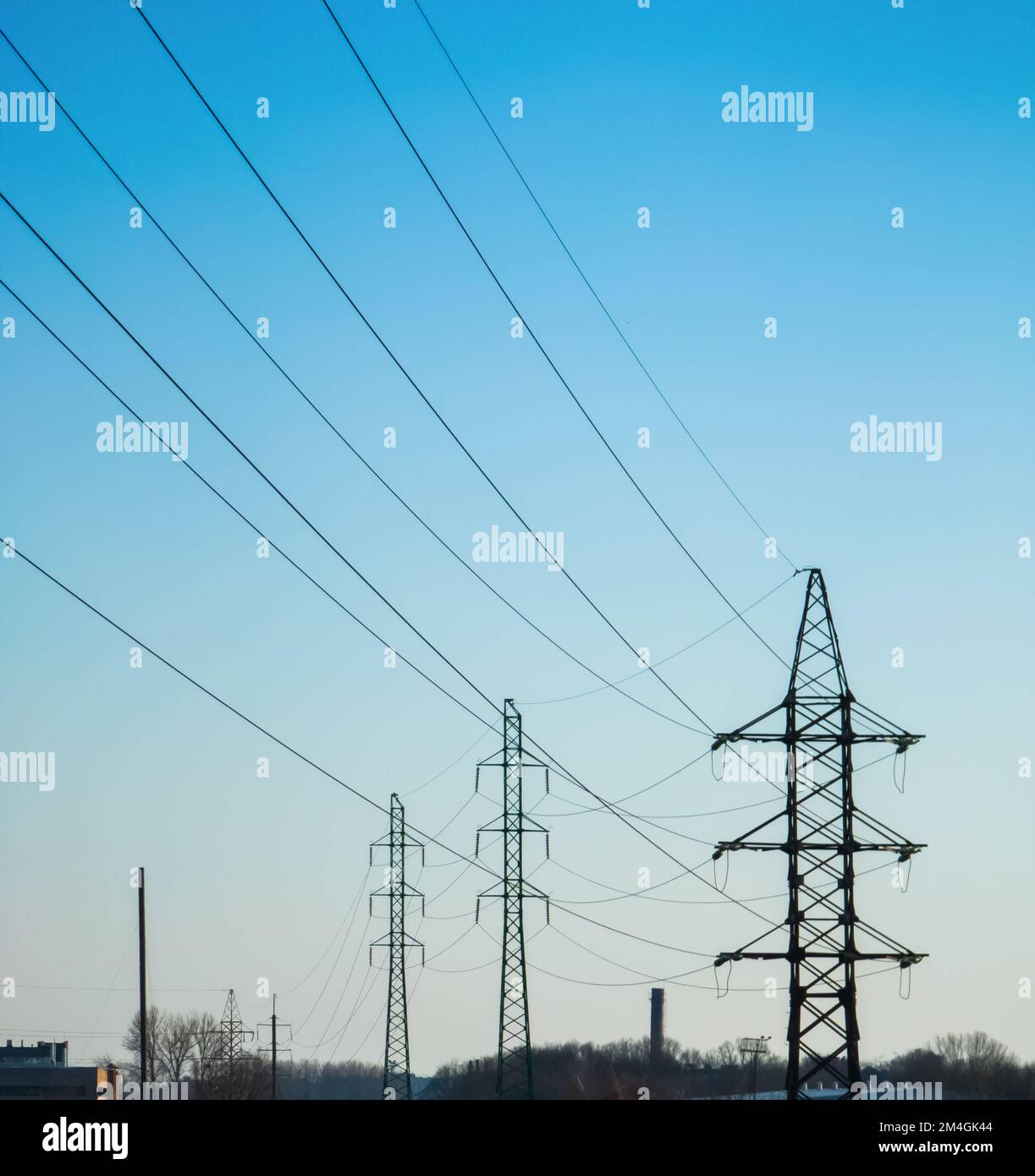 High voltage electricity power line towers against the sky Stock Photo ...