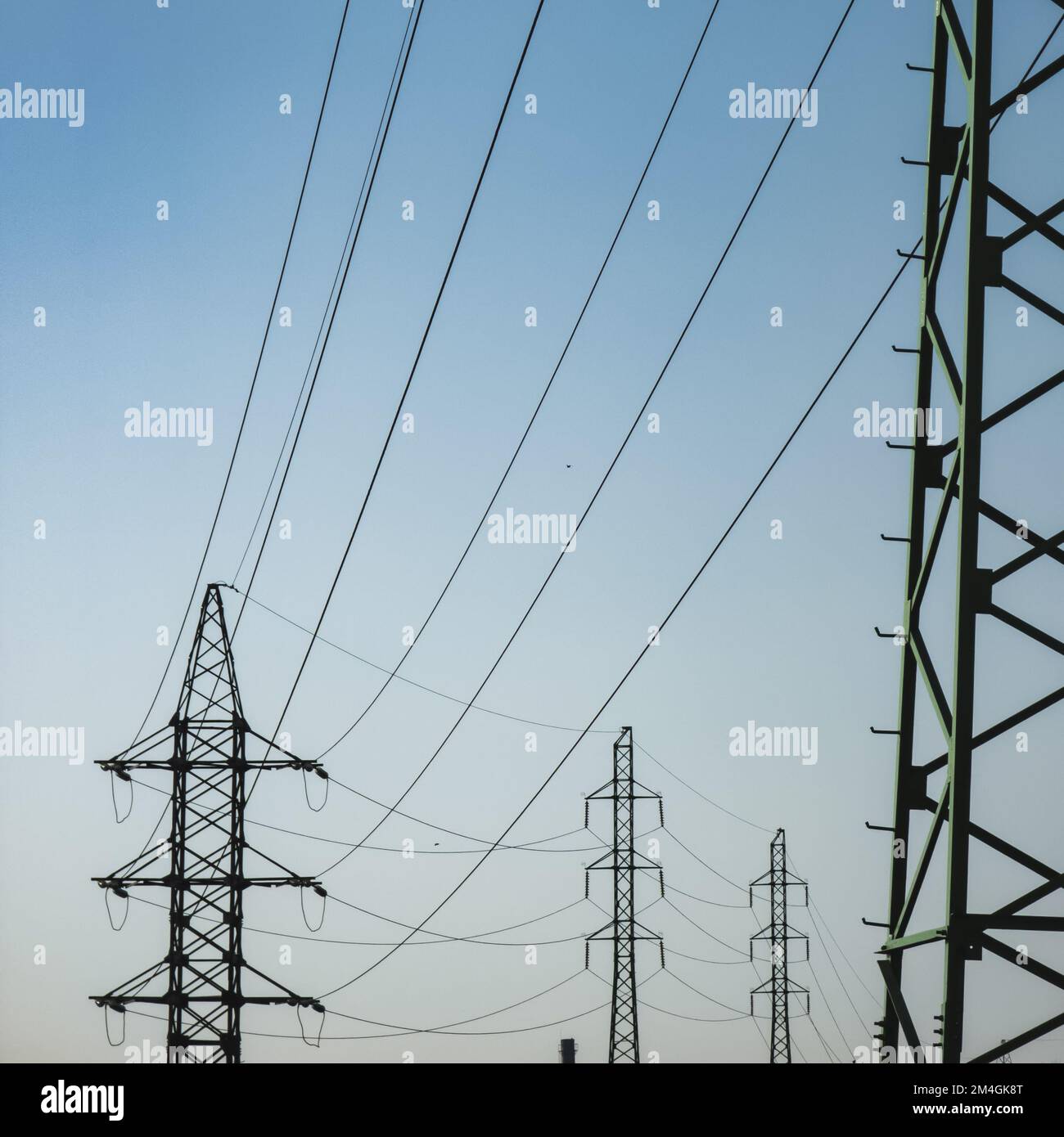 High voltage electricity power line towers against the sky Stock Photo ...