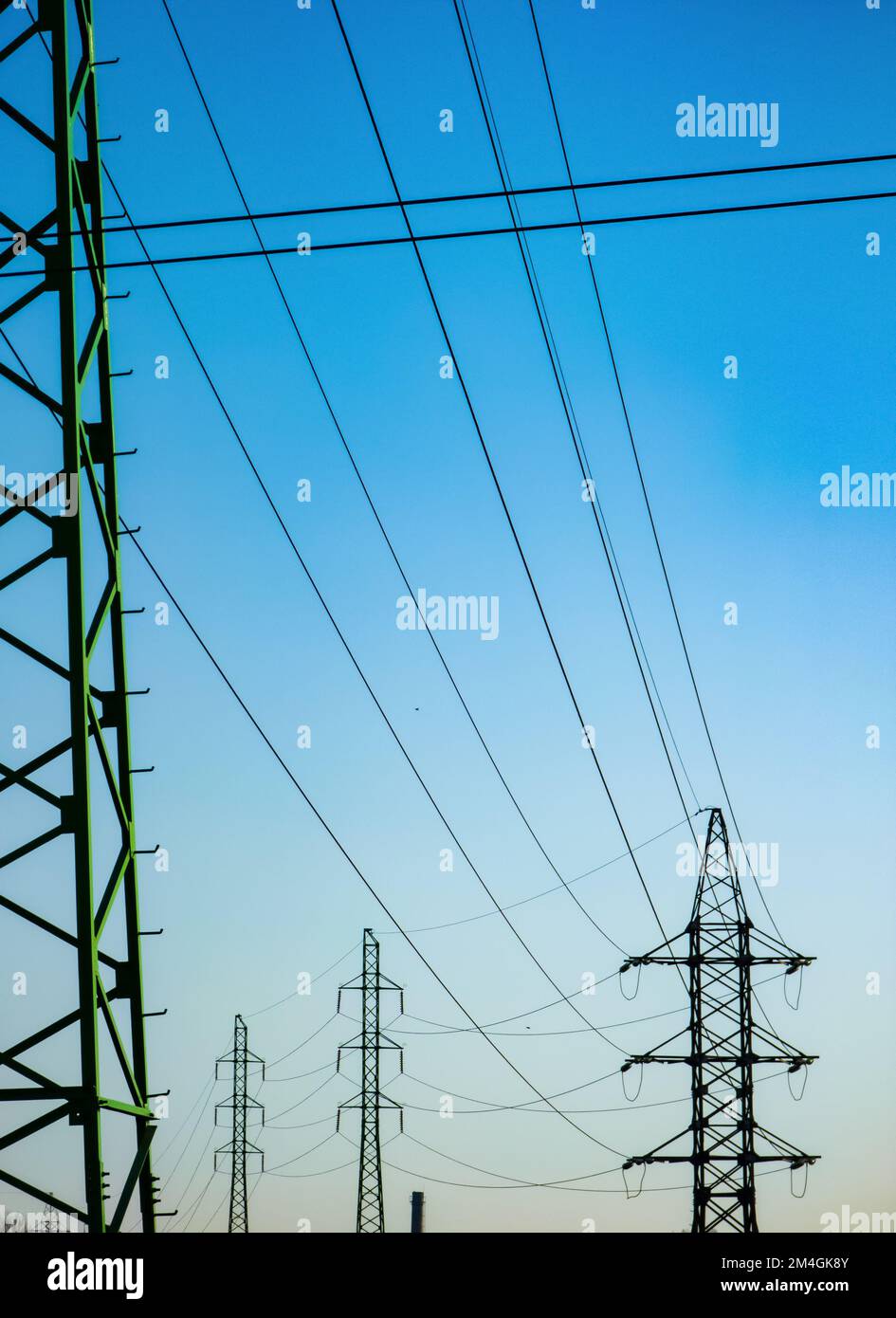 High voltage electricity power line towers against the sky Stock Photo ...