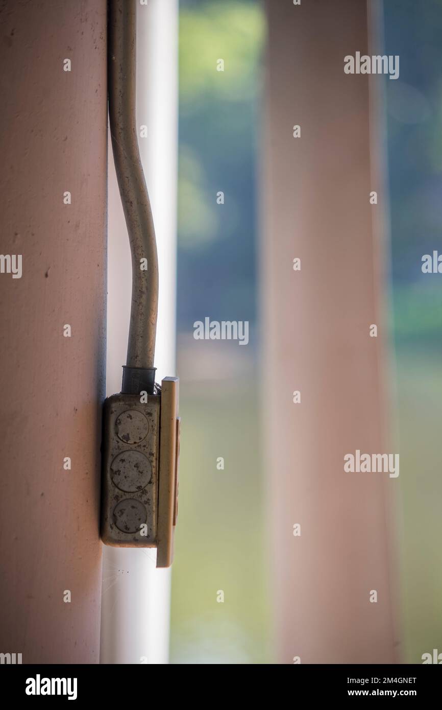 Plastic electric plug on concrete wall with steel tube Stock Photo Alamy