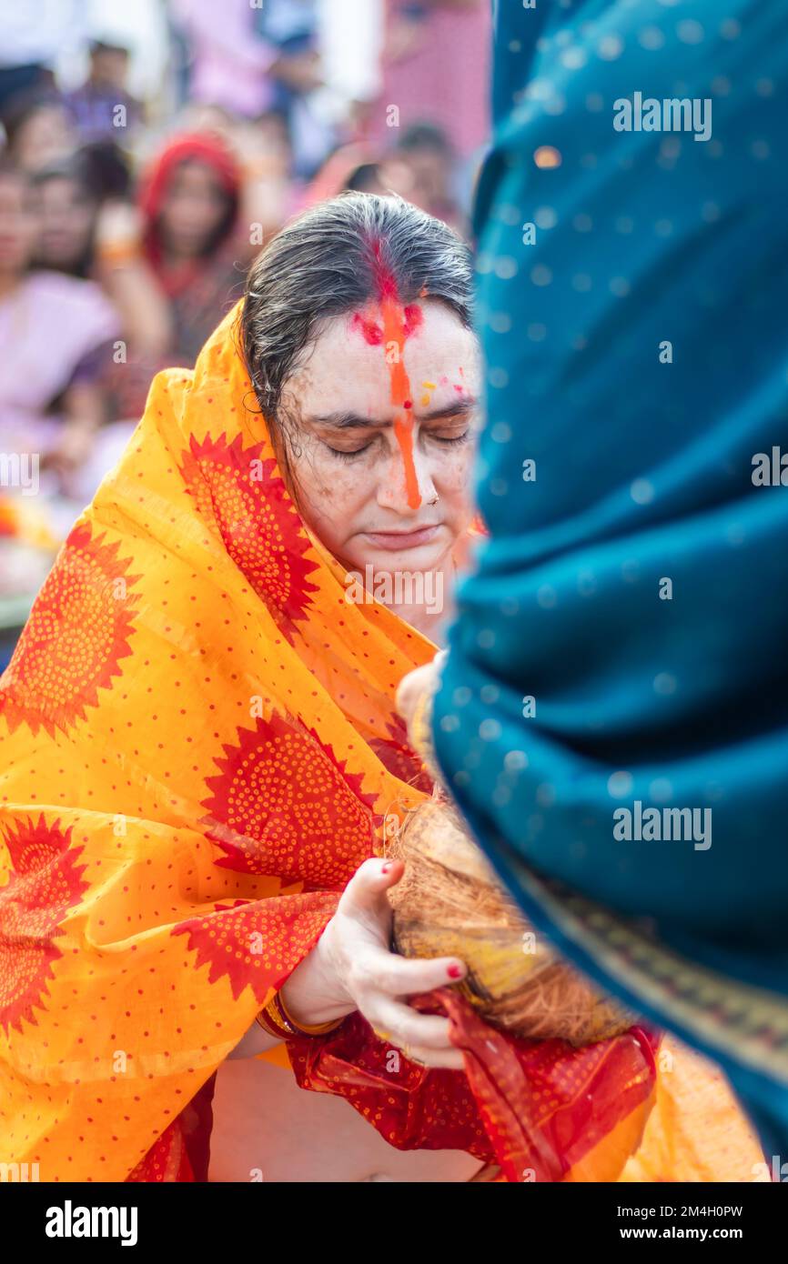 women devotee with religious offerings for sun god in Chhath festival Stock Photo