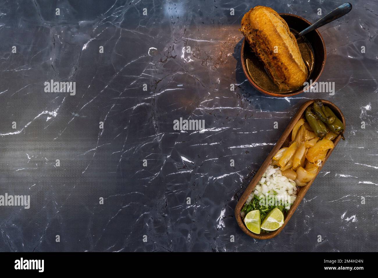 chile and roasted onion, chopped red onion with cilantro, torta ahogada de res Stock Photo Alamy