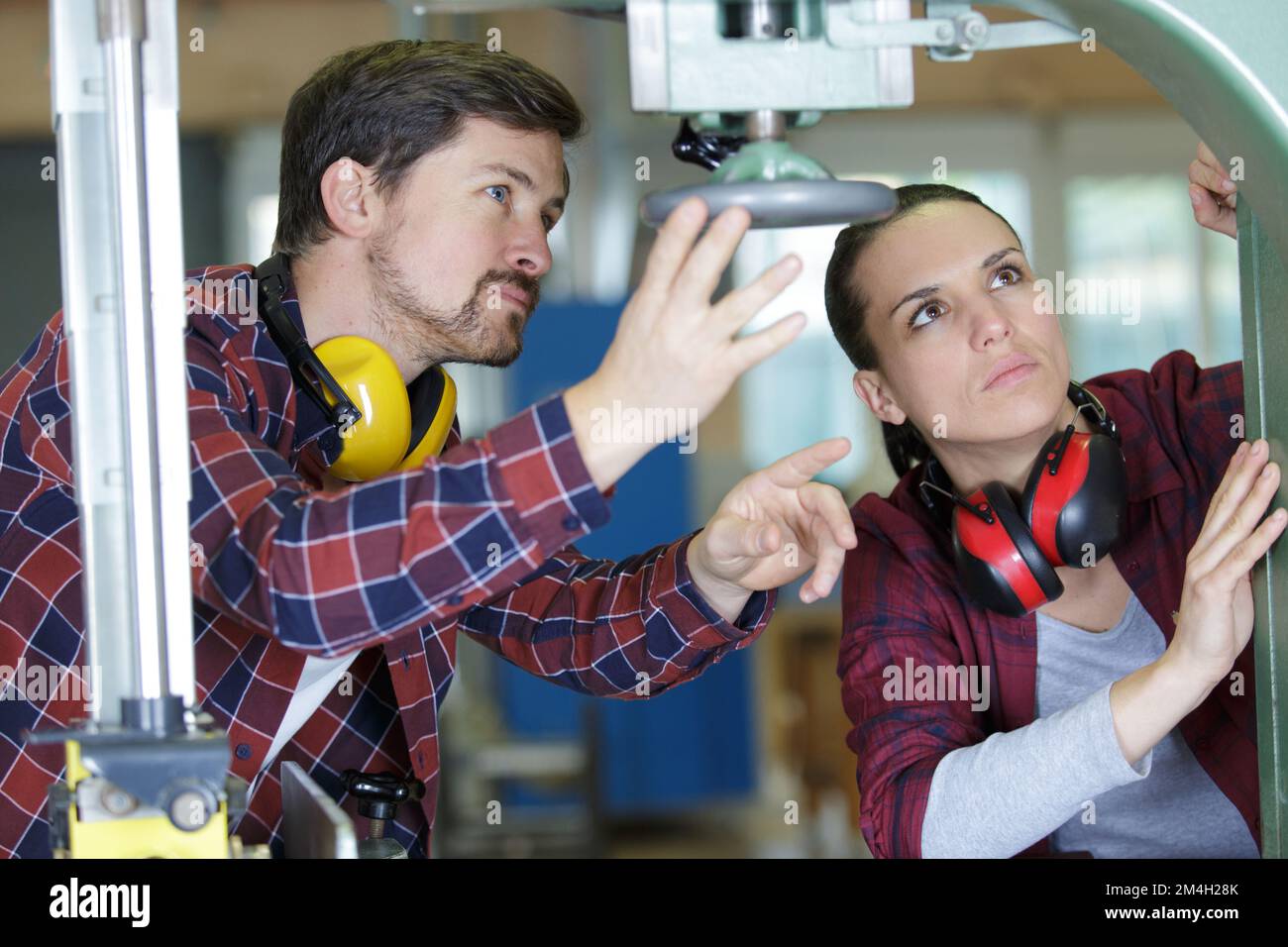 man and woman with machine cnc Stock Photo - Alamy