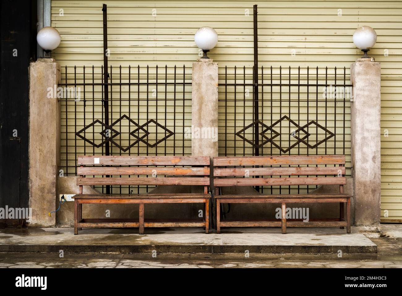 An old wooden bench in an old neighborhood outdoors Stock Photo - Alamy