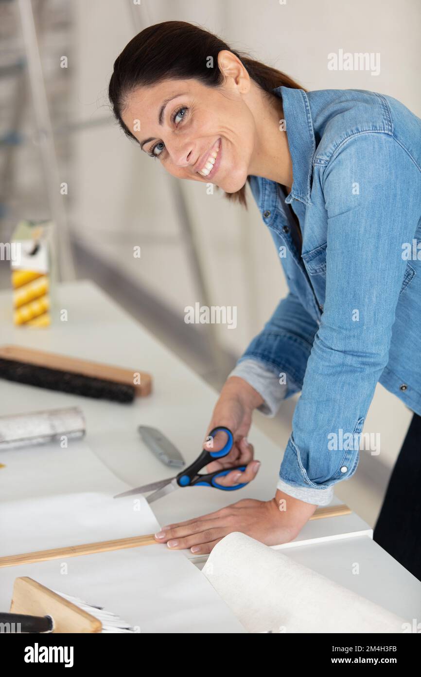 woman preparing for wallpaper work Stock Photo