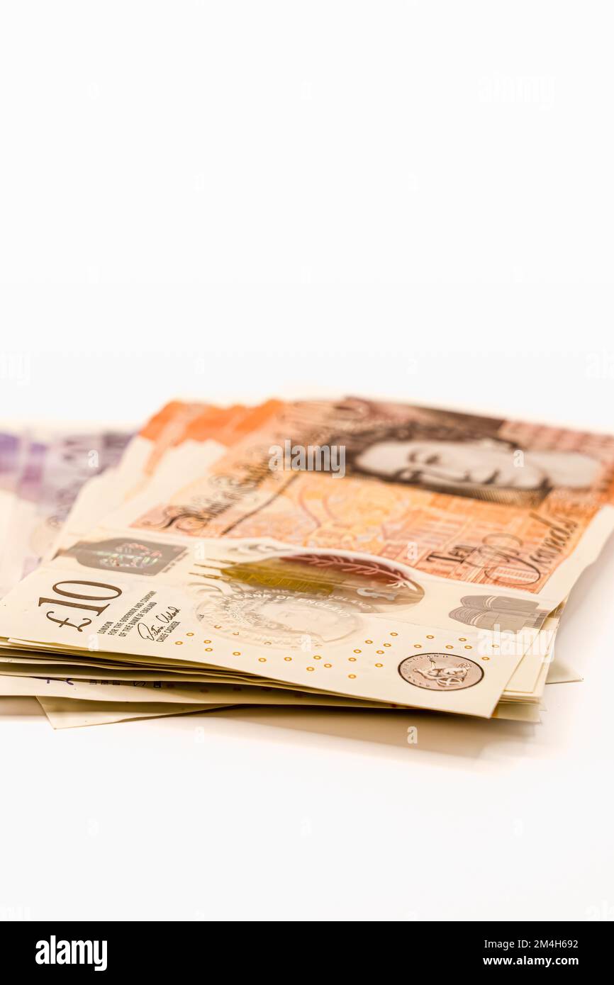 close-up of a small pile of ten and twenty pound notes Stock Photo