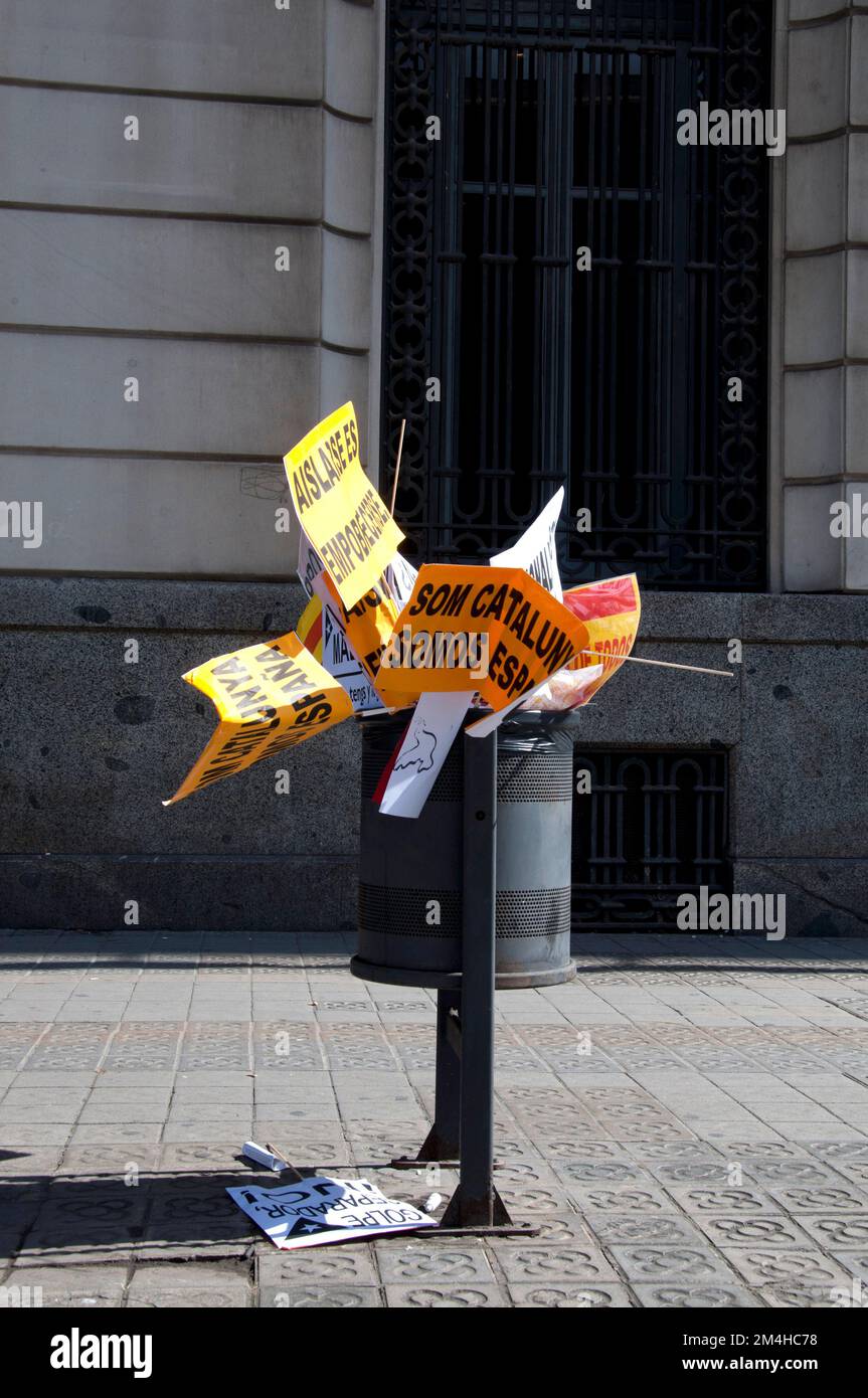 Wastepaper basket filled with banners after the demonstration against catalan separatism, Barcelona, Ciutat Vella, Spain Stock Photo
