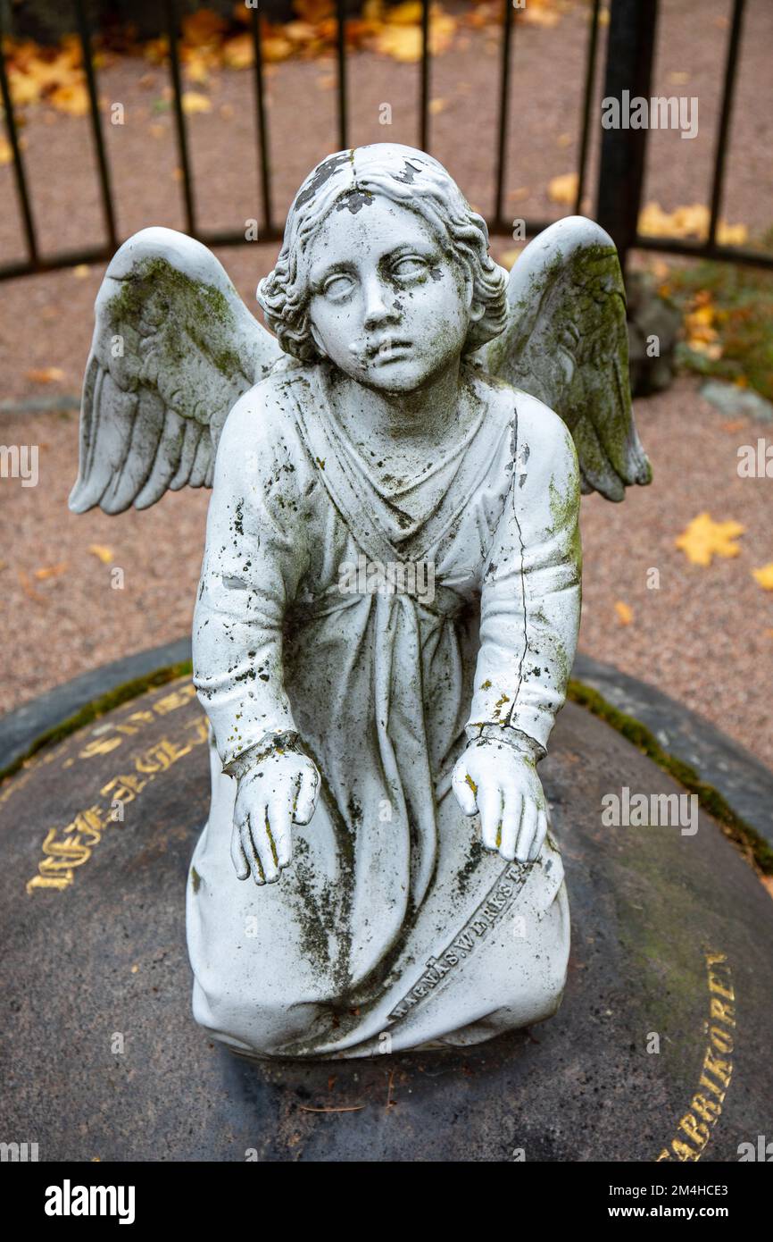 Angel sculpture on a headstone in Hietaniemi cemetery, Helsinki, Finland Stock Photo Alamy