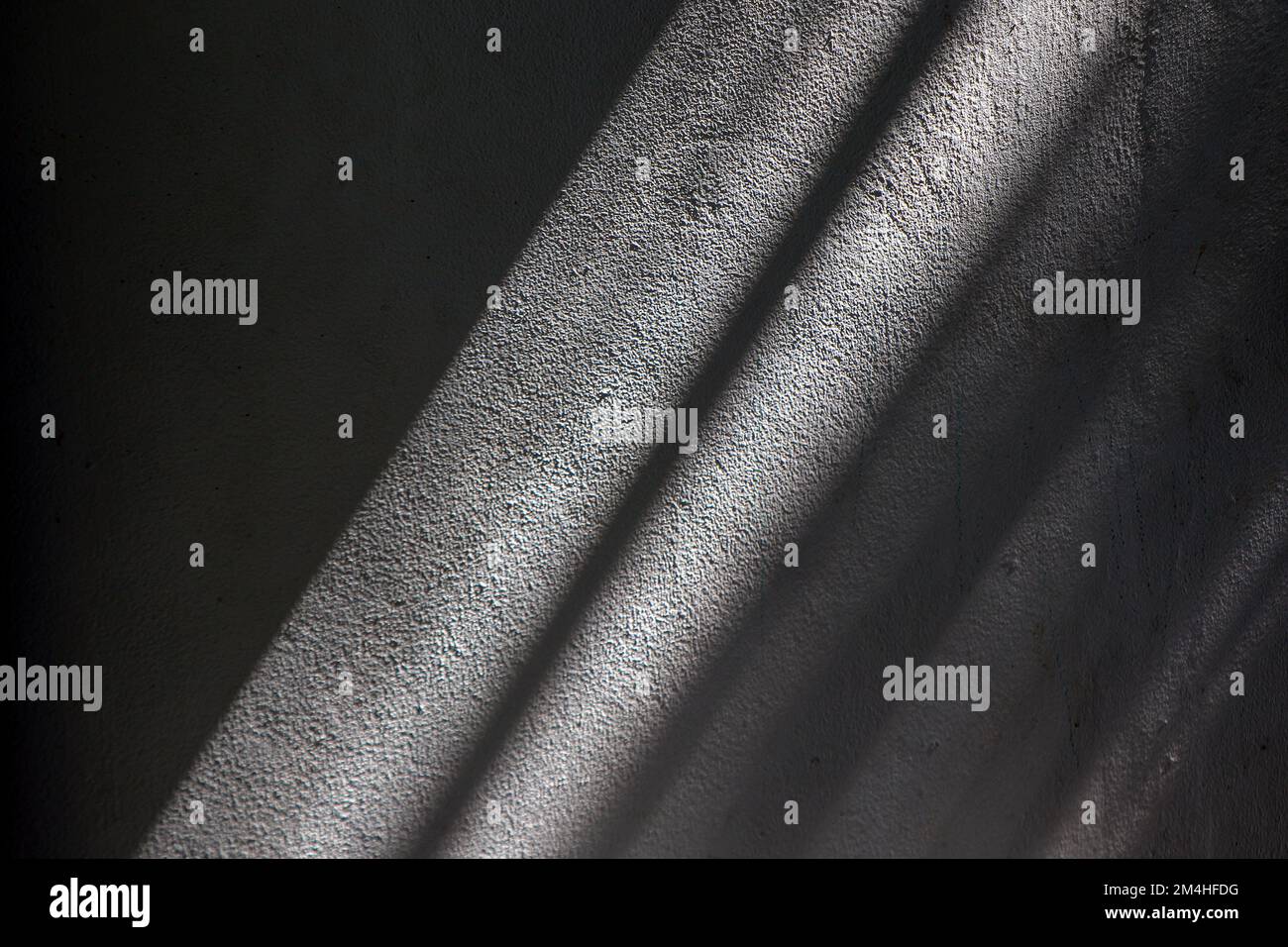 light and shadow on the rough walls of the house Focus on slightly blurry images. Stock Photo