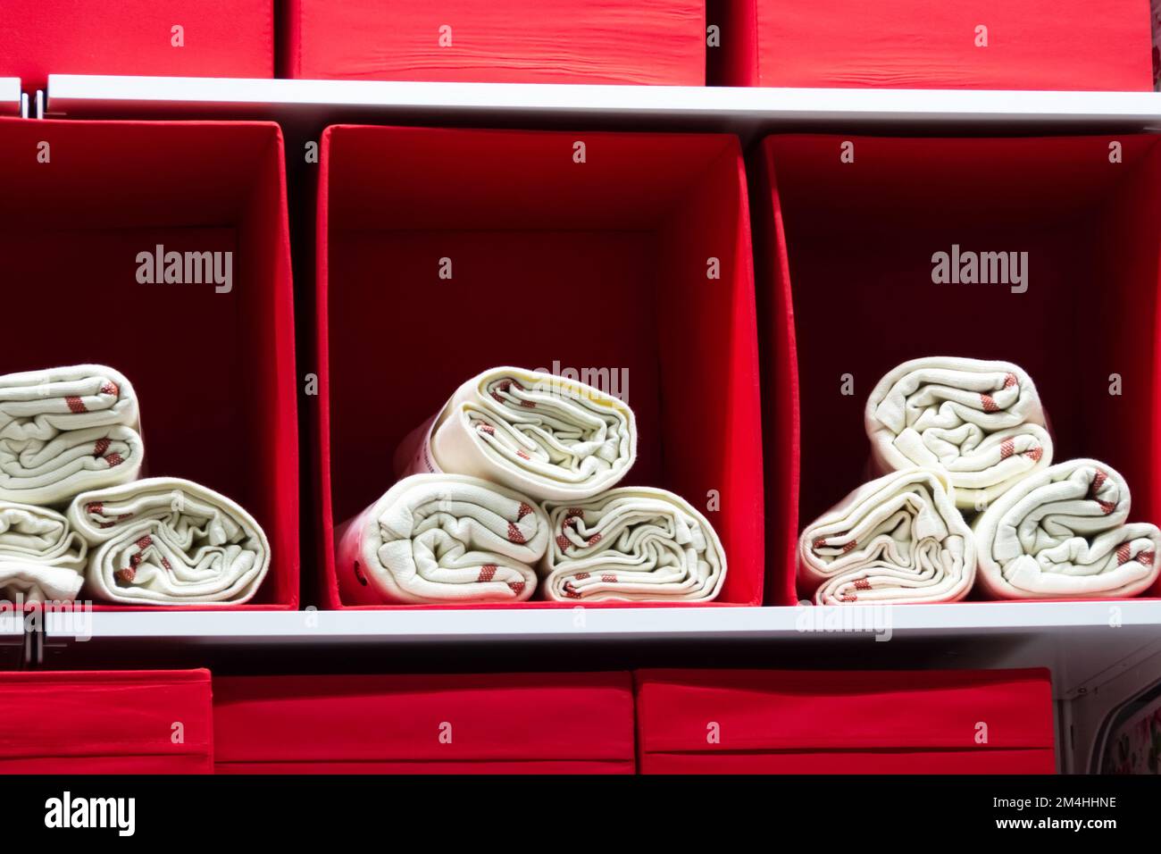 White towels in red boxes on store shelves Stock Photo
