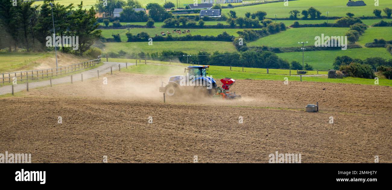 West Cork, Ireland, August 20, 2022. A tractor sows a plowed field in