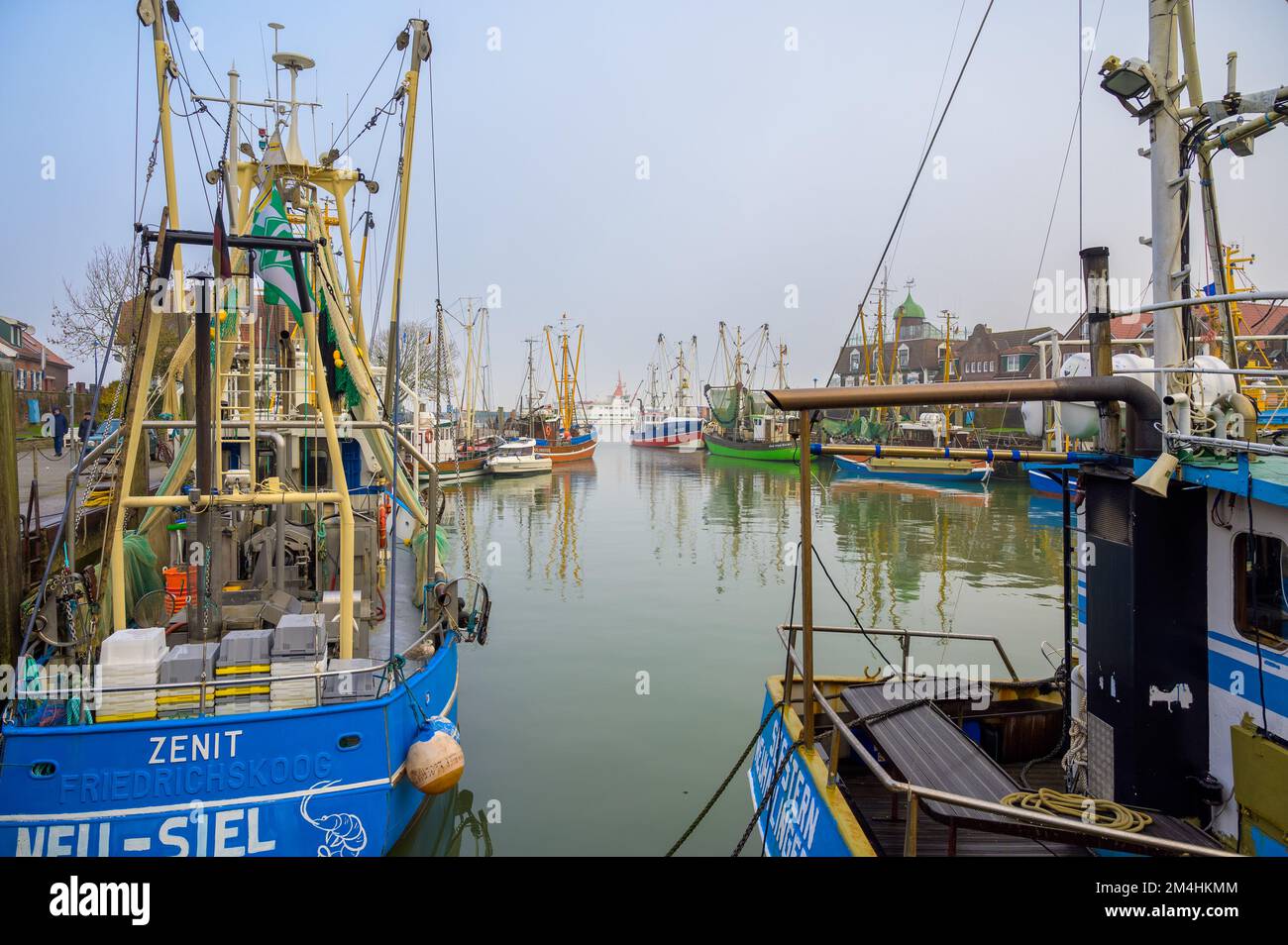 NEUHARLINGERSIEL, GERMANY - NOVEMBER 26, 2022: Port with historic ...