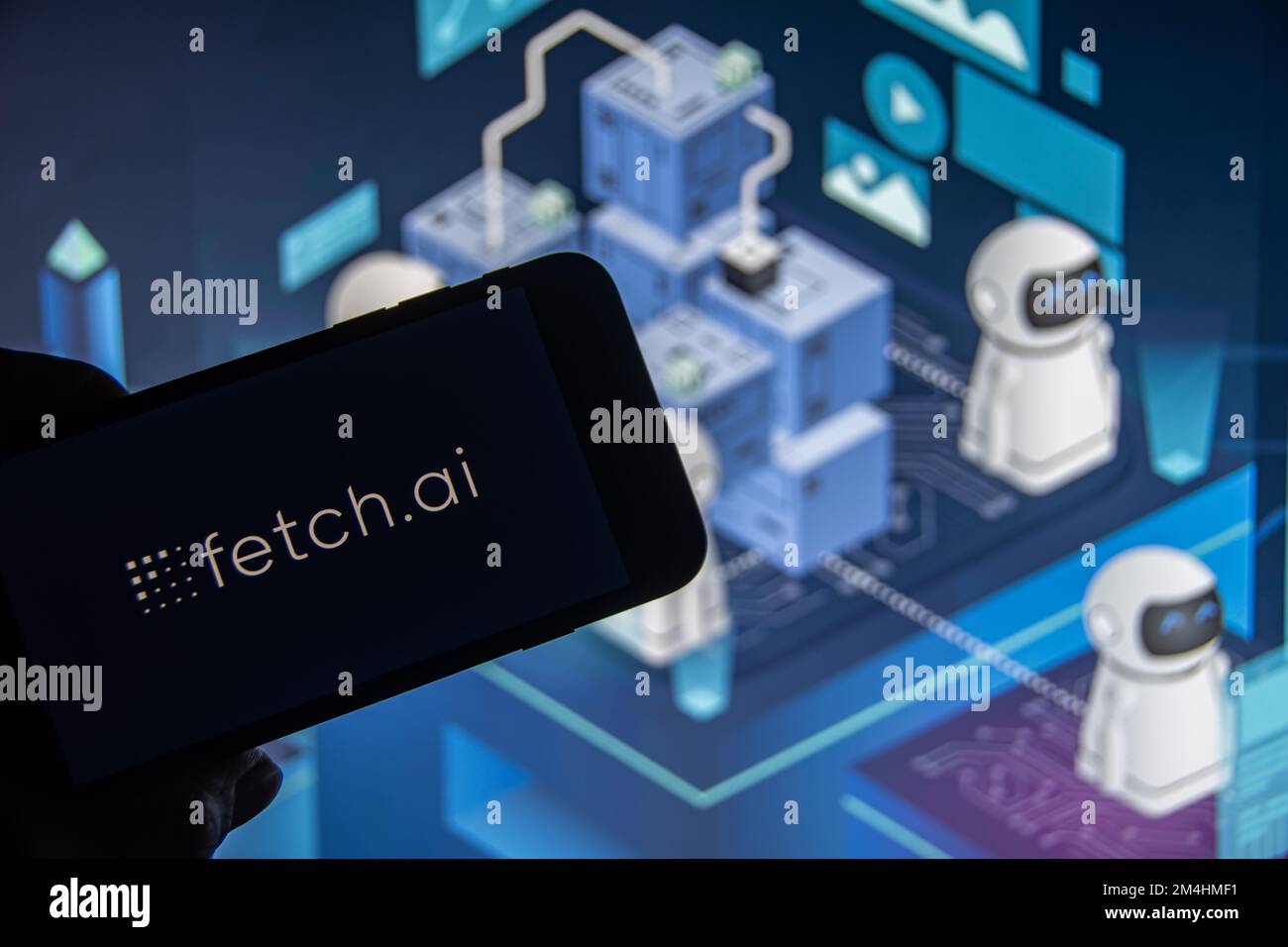 Rheinbach, Germany  20 December 2022,  The logo of the cryptocurrency 'Fetch.ai' on the display of a smartphone (focus on the logo) Stock Photo