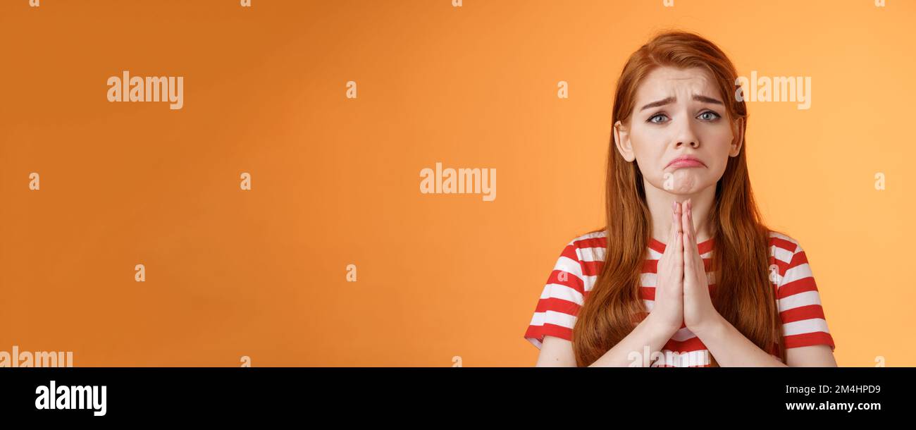 Pity uneasy redhead girl pull sad face, quivering lip upset, begging mercy, apologizing, plead