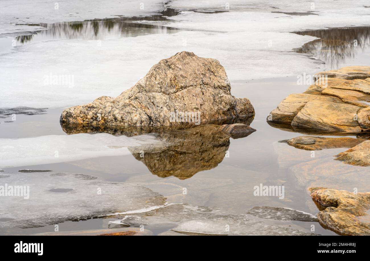 Parry Spring Melting ice, shoreline granite rock on Georgian Bay in early spring ...