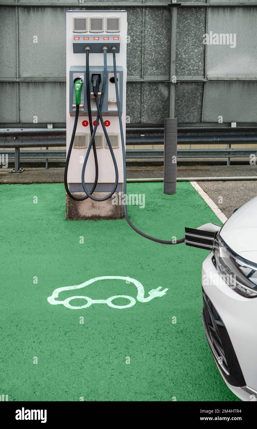 Electric vehicle charging station with car Stock Photo Alamy