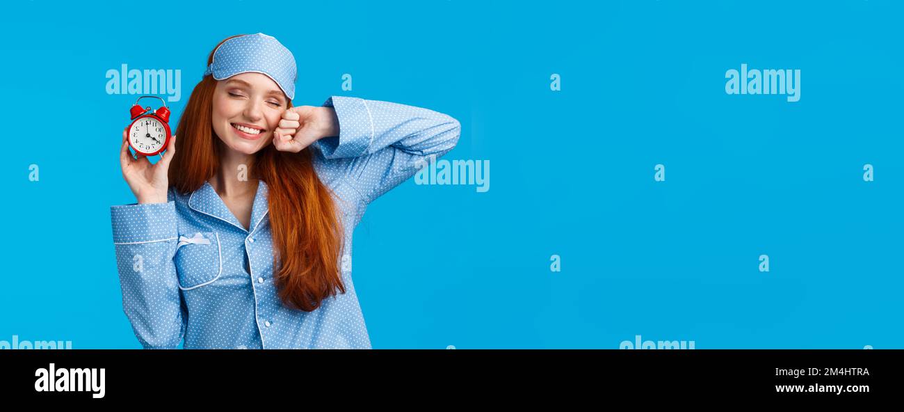 Girl slept well, wake up energized, sleepy stretching with closed eyes