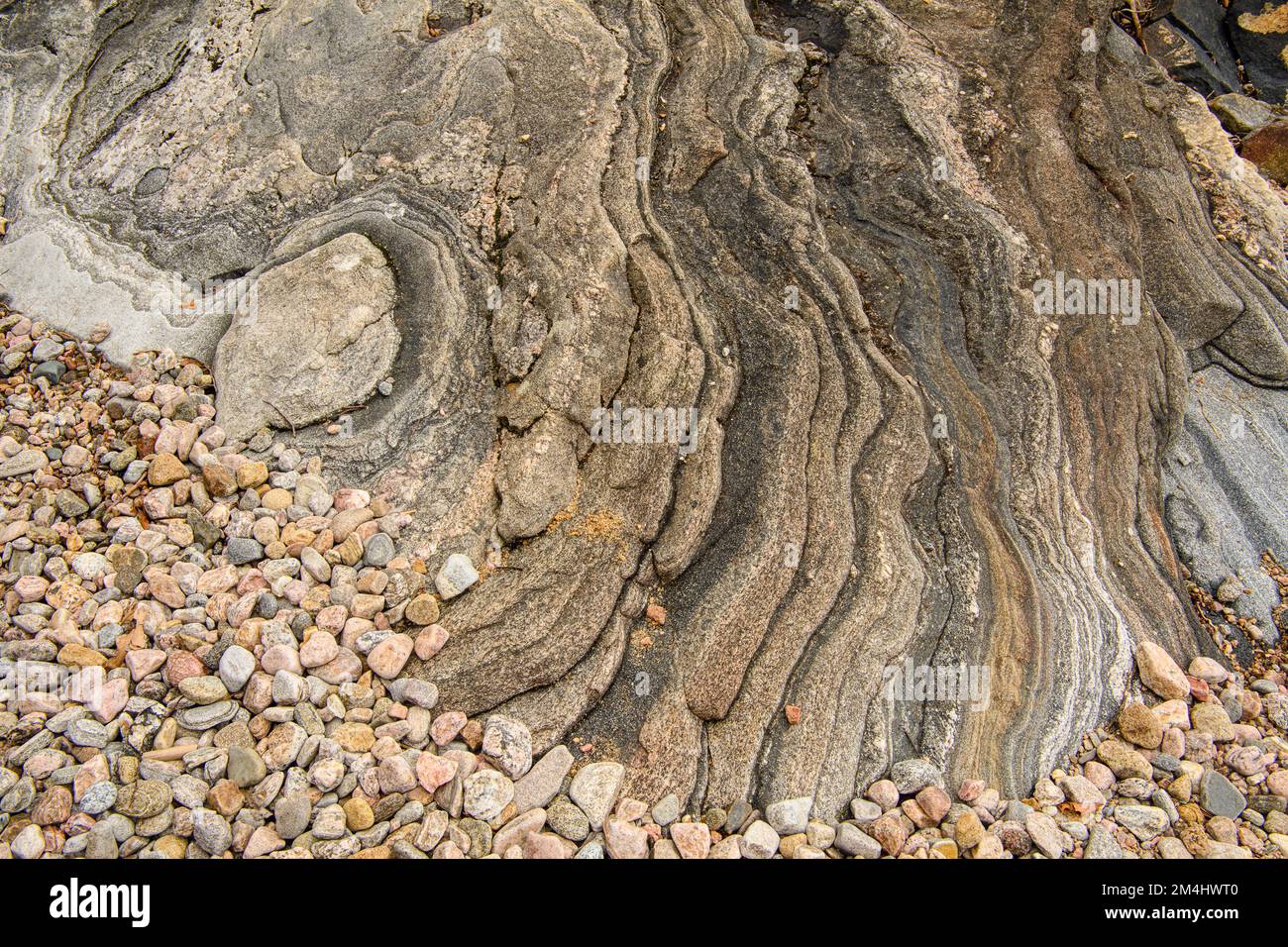 Shoreline granite rock, pebbles on Georgian Bay , Parry Sound, Ontario, Canada Stock Photo