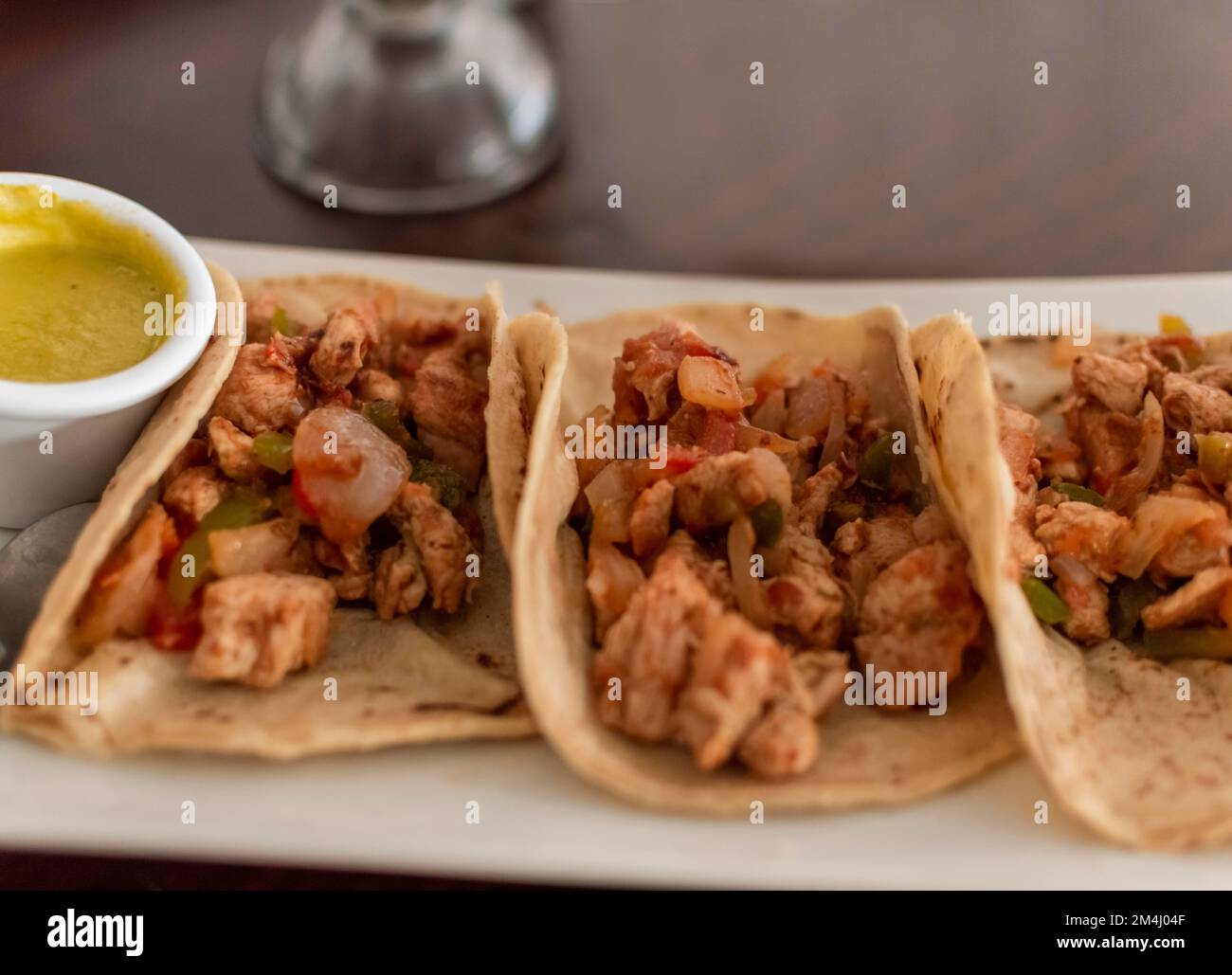 Mexican tacos al pastor served with hot sauce, Delicious Mexican