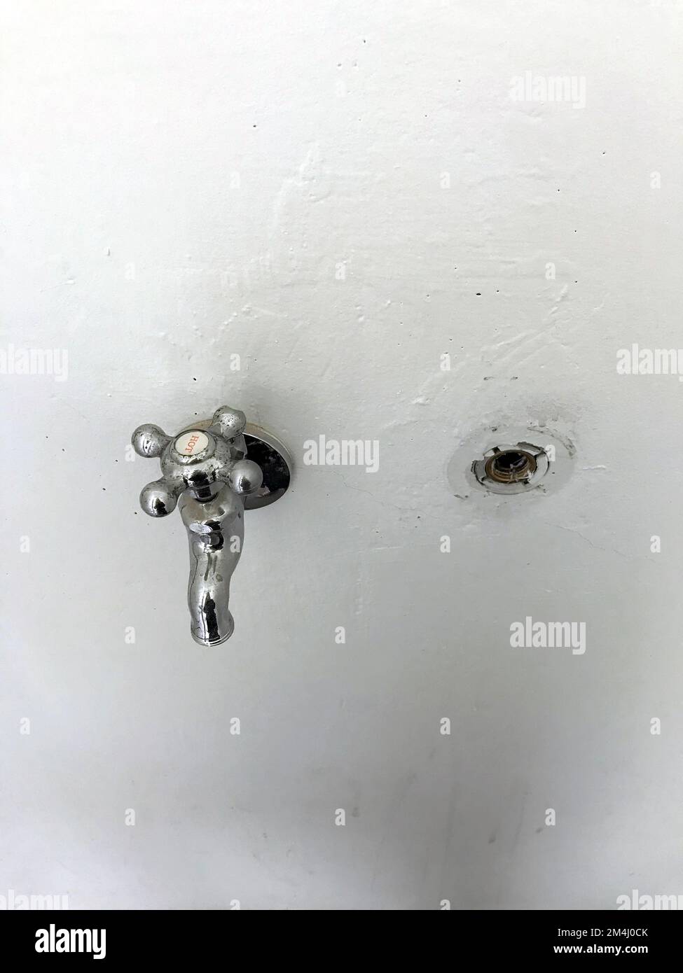 The single tap on the white wall Stock Photo