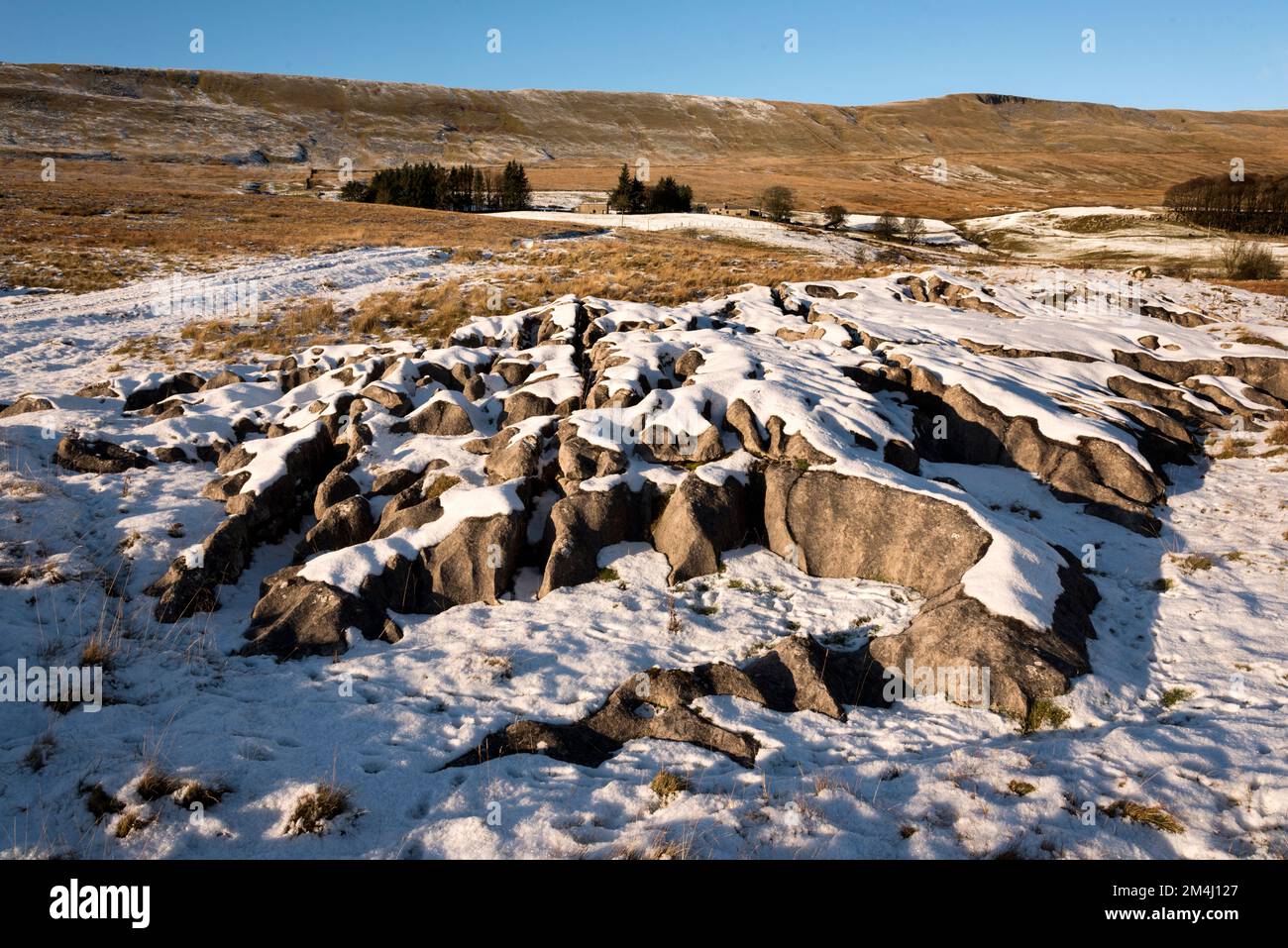 Snow-covered limestone pavement, Chapel-le-Dale, Yorkshire Dales National Park. Stock Photo