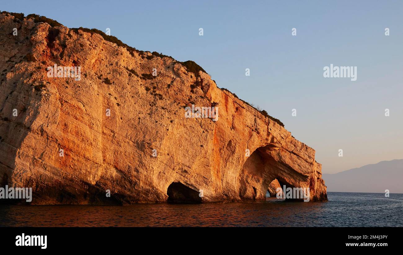 Blue Caves, morning light, rocky coast, blue cloudless sky, northeast coast, Zakynthos Island, Ionian Islands, Greece Stock Photo