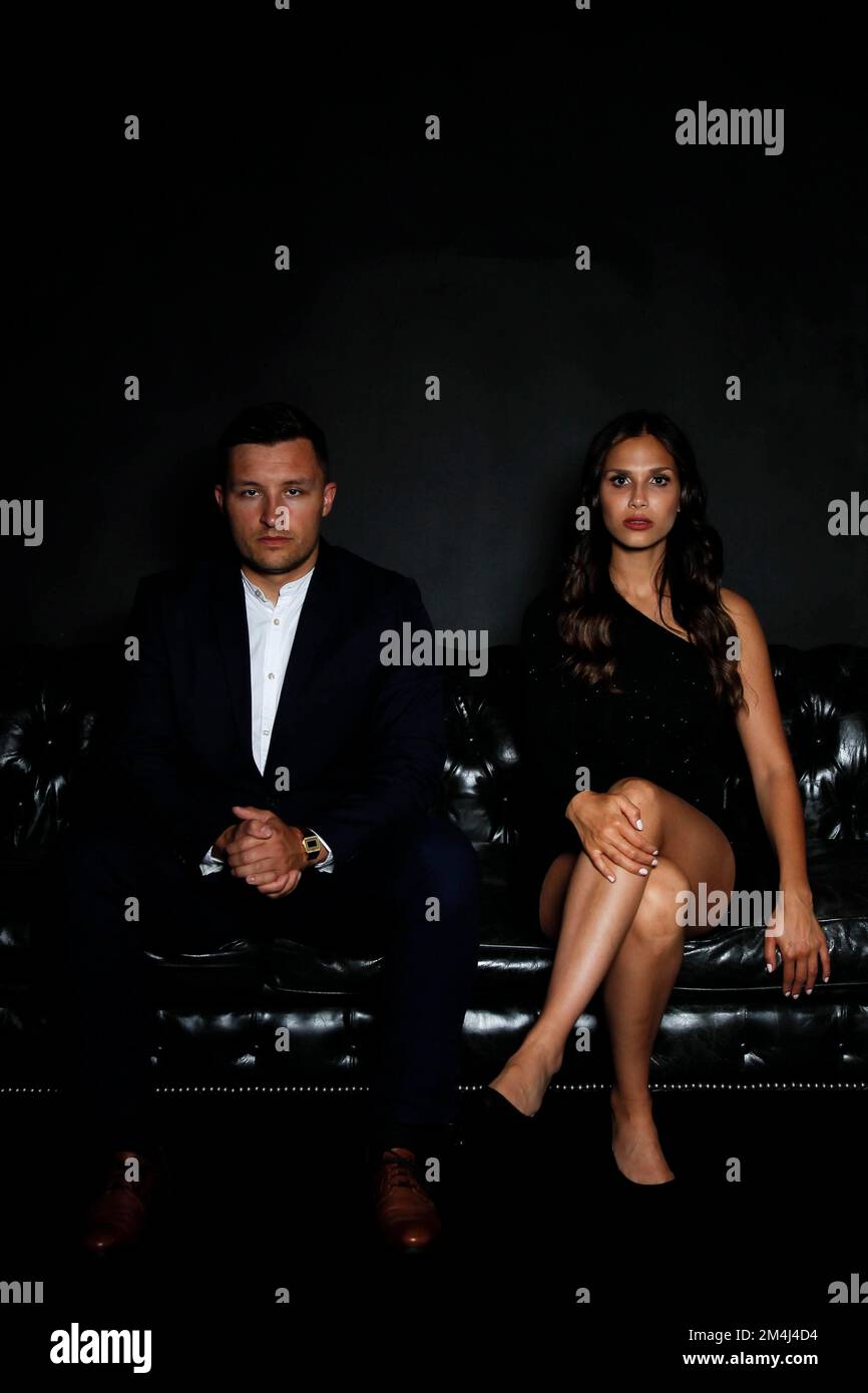 Man woman sofa serious hi-res stock photography and images - Alamy