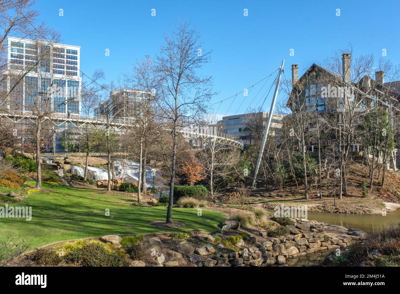 Falls Park on the Reedy view of the Liberty Bridge and downtown Greenville, South Carolina buildings Stock Photo