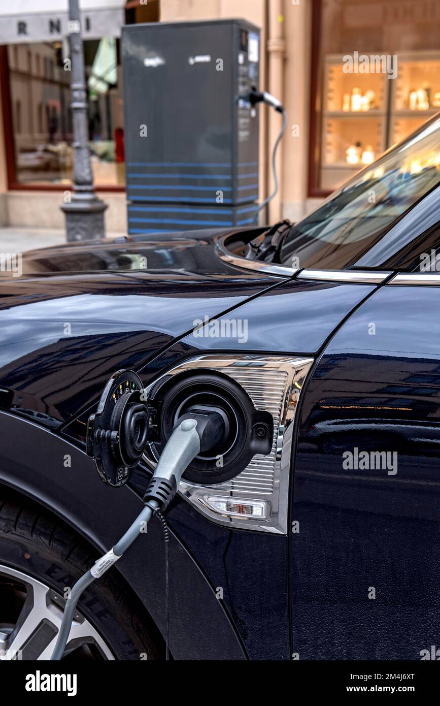 Charging coupling, plug on electric car, electric vehicle charging at