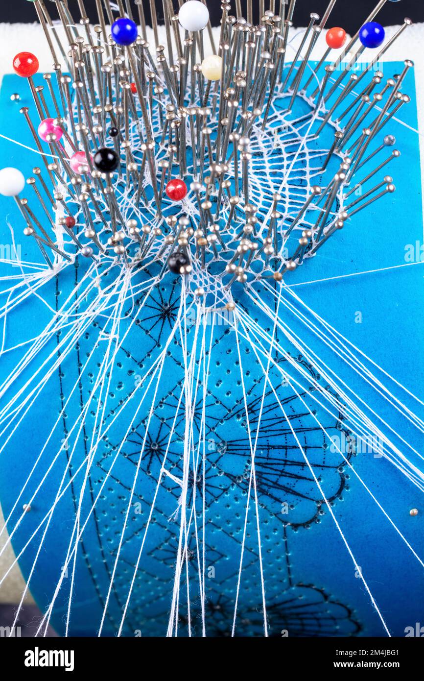 Roller pillow to make bobbin lace. Bobbin lace is a lace textile made