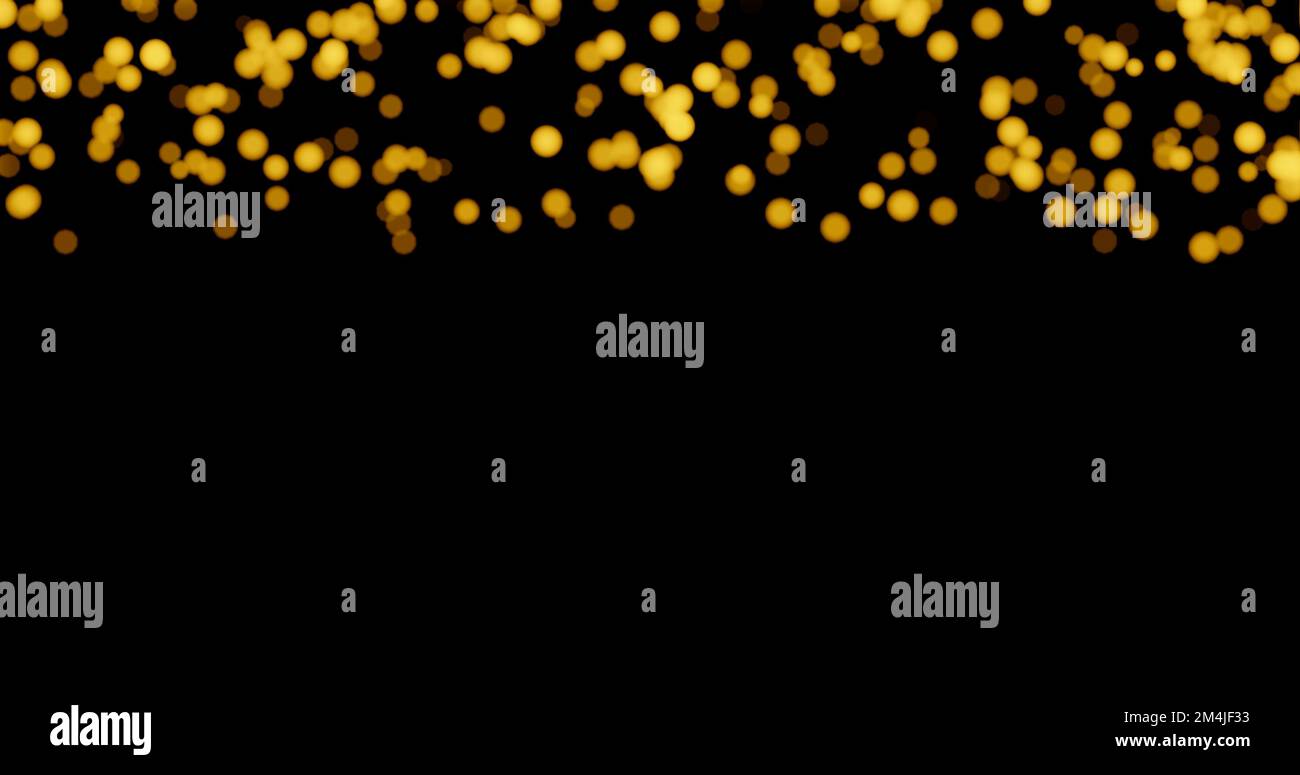 Golden blurred bokeh lights on black background Stock Photo - Alamy