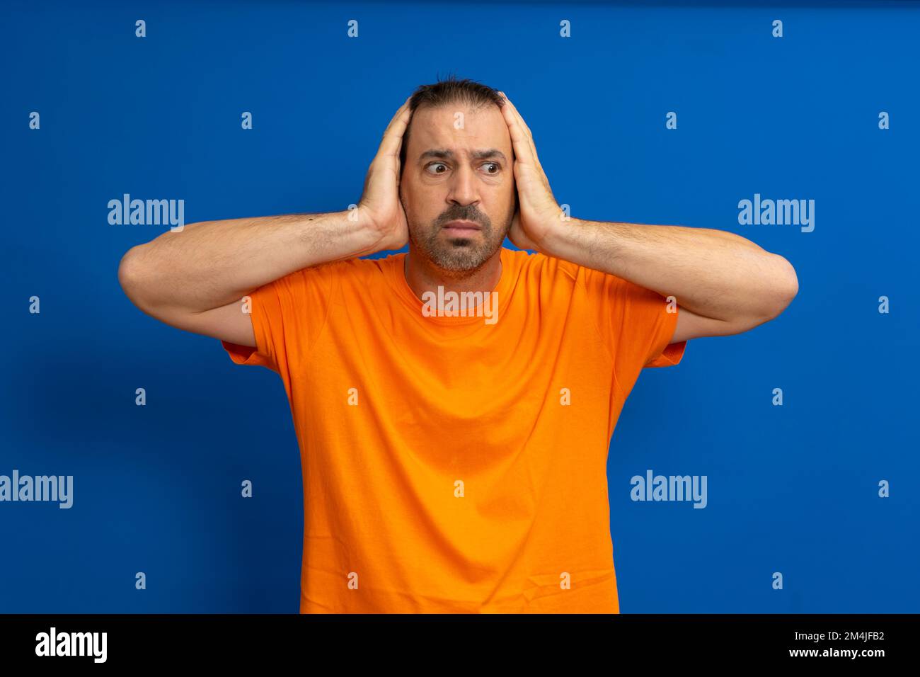 Person in orange shirt hi-res stock photography and images - Alamy