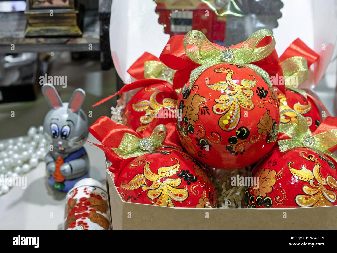 Wooden Christmas balls with firebird in Russian Khokhloma style. Stock Photo