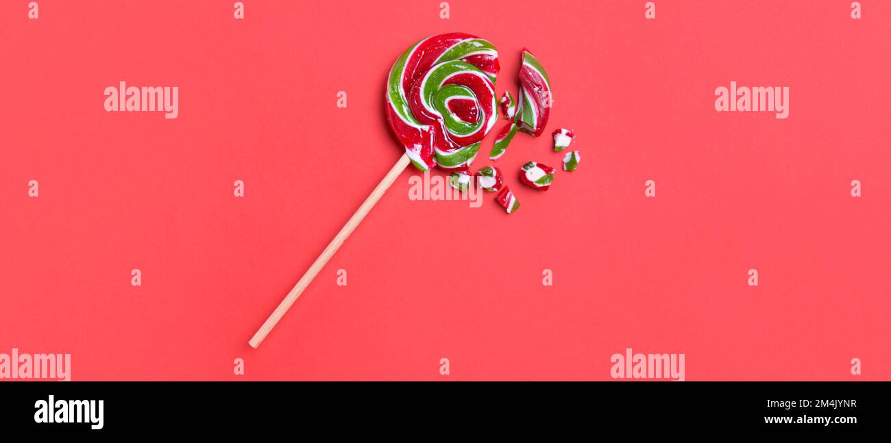 Crushed lollipop on red background Stock Photo Alamy