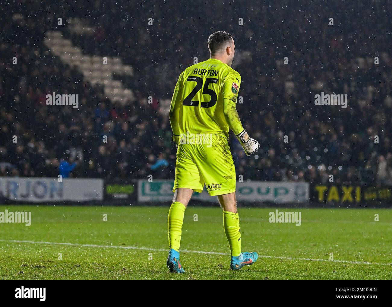 Plymouth Argyle goalkeeper Callum Burton (25) celebrates his save from the  penalty spot during the Papa John's Trophy match Plymouth Argyle vs AFC  Wimbledon at Home Park, Plymouth, United Kingdom, 21st December