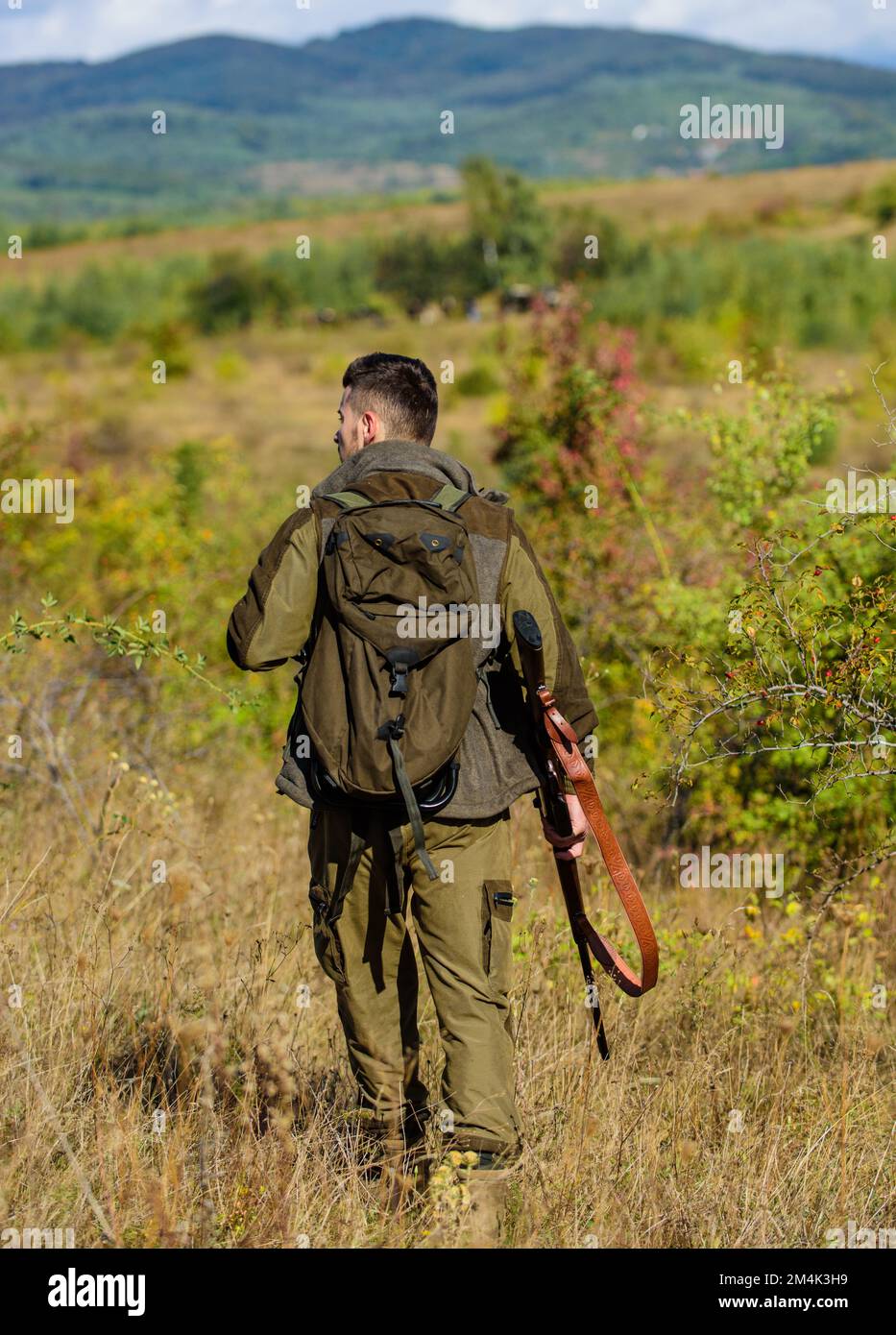 Hunting weapon gun or rifle. Man hunter carry rifle nature background