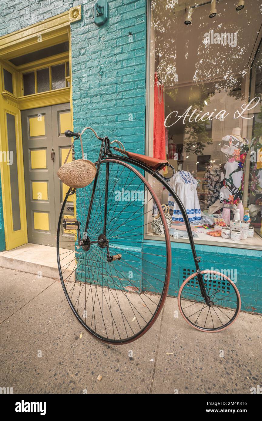 Famous Penny Farthing or High Wheel bicycle on the street Stock Photo ...