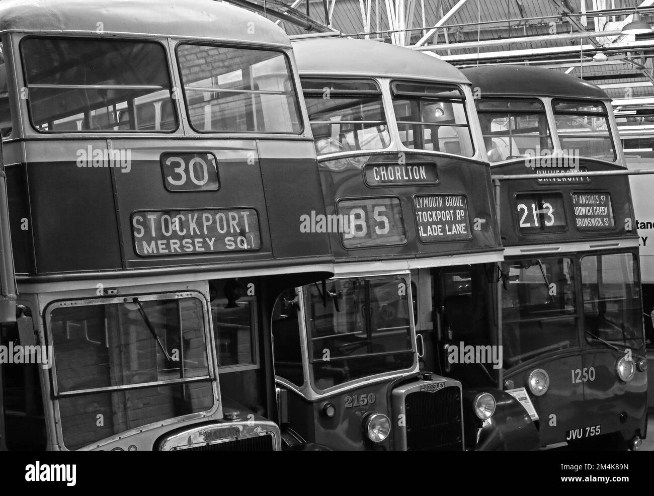 Manchester historic buses in Queens Road depot, Stockport 30, Chorlton 85, University 213, 1951 Crossley Dominion Trolley Bus JVU755 Stock Photo