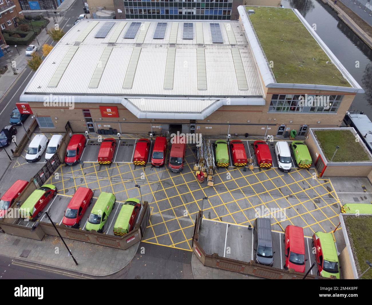 Mail delivery vans are parked at Royal Mail Islington Delivery Office