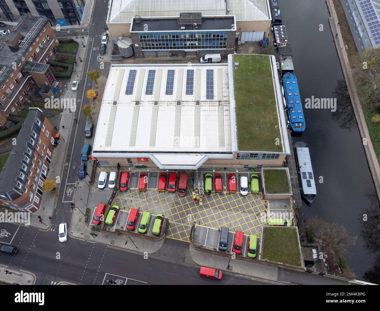 Mail delivery vans are parked at Royal Mail Islington Delivery Office