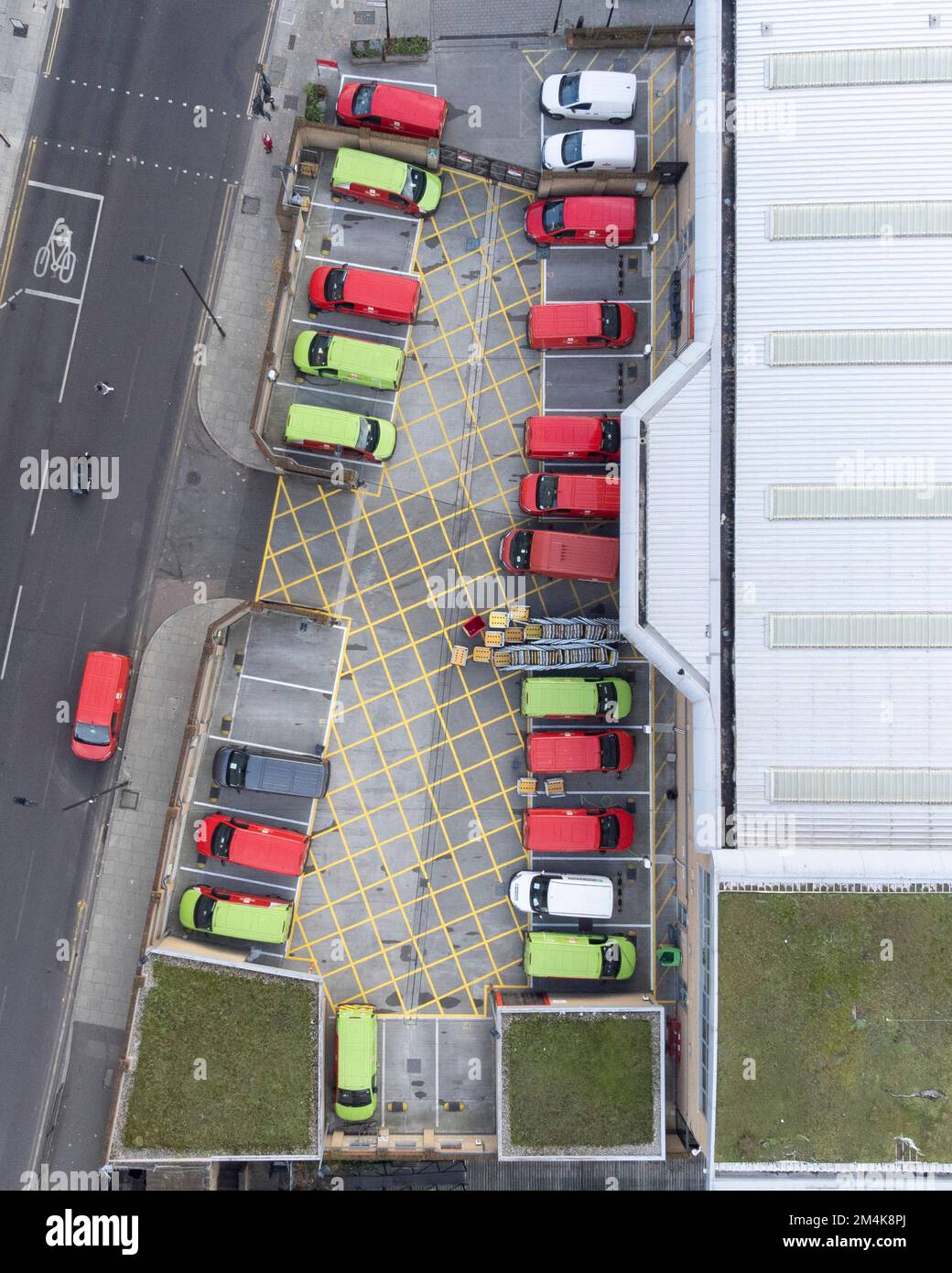 Mail delivery vans are parked at Royal Mail Islington Delivery Office