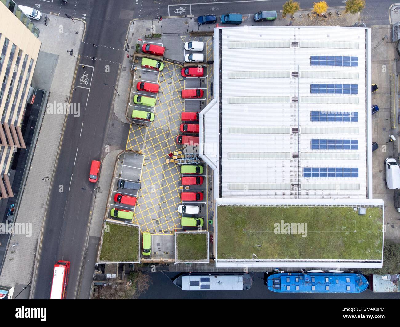 Mail delivery vans are parked at Royal Mail Islington Delivery Office