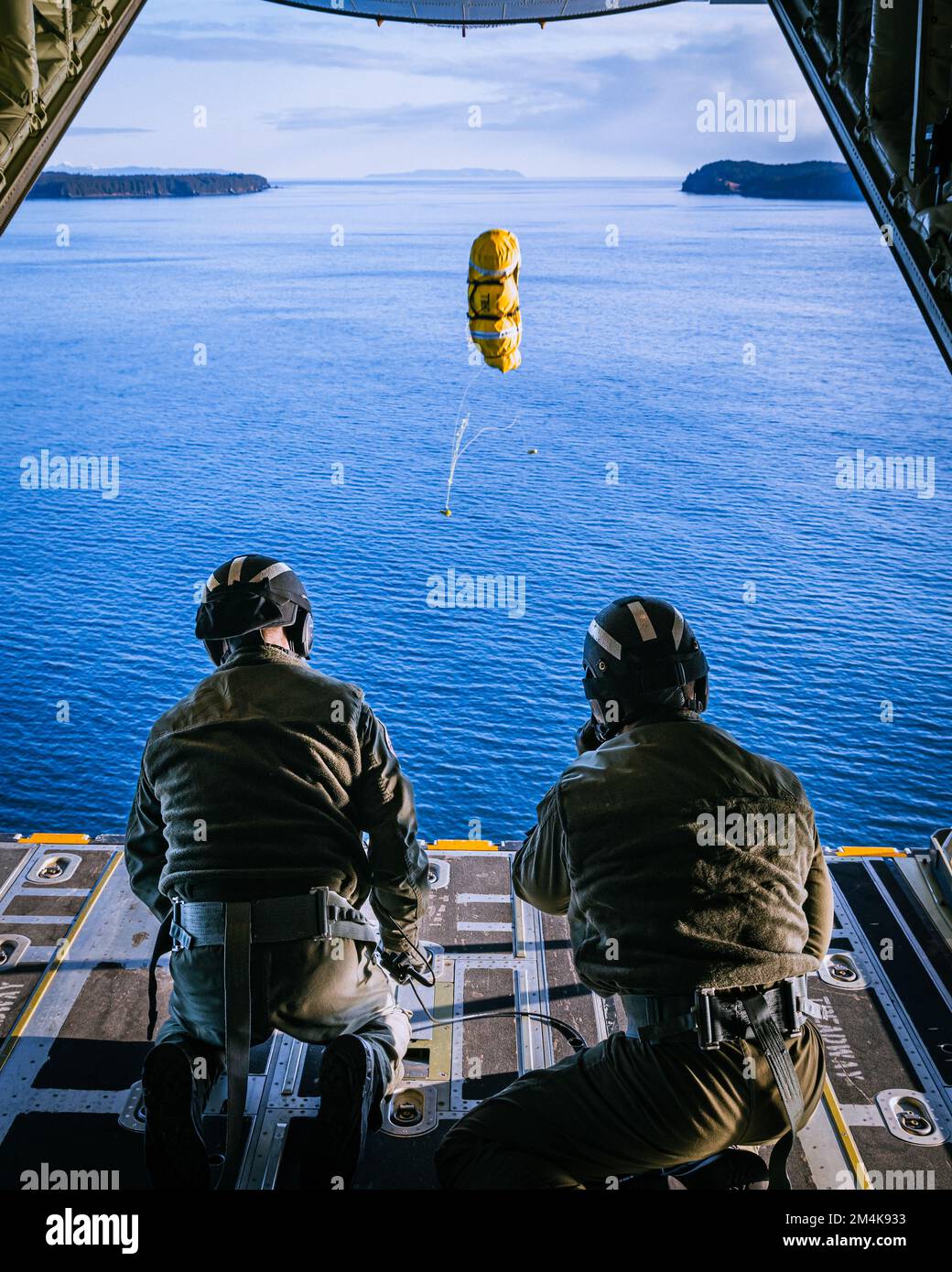 An Air Station Kodiak C-130J Super Hercules airplane flight crew deploys a training rescue package in Kodiak, Alaska, on March 17, 2022. U.S. Coast Guard photo by Lt. Scott Kellerman. Stock Photo